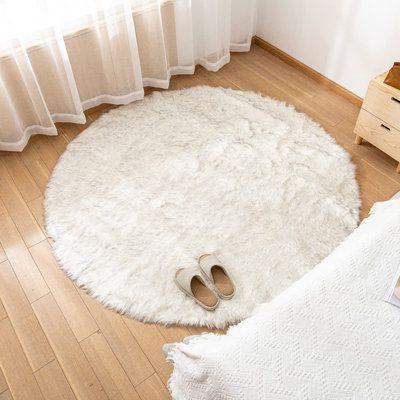 Round white fluffy rug